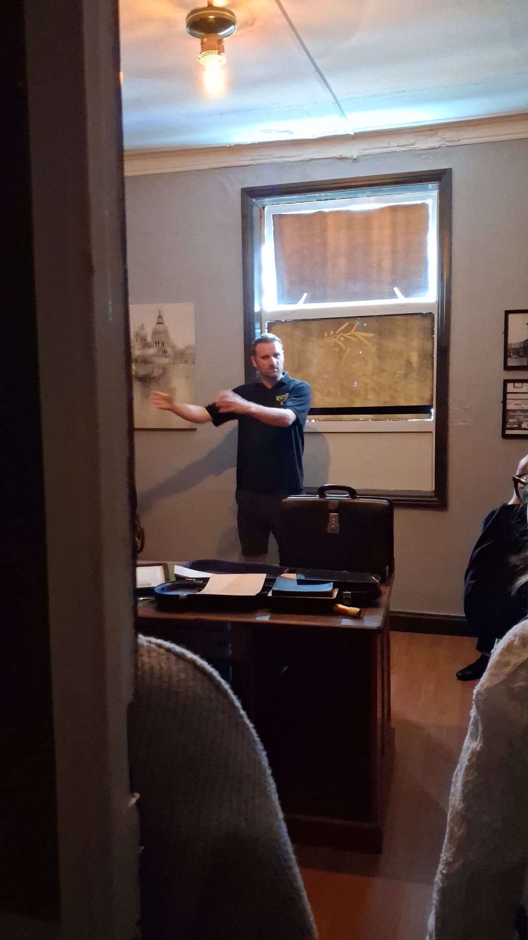 Danny showing Harrison College students how an escape room is reset at Enigma Rooms Doncaster.